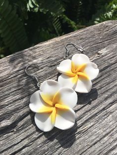 "Excited about your trip to Hawaii? Or maybe a cruise? Sun-soaked wedding? Grab a pair of these lightweight earrings that are perfect for such an occasion. White/yellow plumeria flowers are made from polymer clay. They are accented with faceted glass beads (back side only) so that there is a little bit of bling should you wear your hair up. The earring itself is stainless steel, so no discoloration or allergic reaction expected. The flower measures approximately 1 1/4\" round, total length of th Hawaiian Earrings, Beach Wedding Tropical, Yellow Plumeria, Wedding Tropical, Trip To Hawaii, Dragonfly Decor, Plumeria Flowers, Hawaiian Vacation, Vacation Cruise