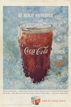 an advertisement for coca cola on ice with a glass full of coke in the middle