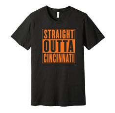 "Represent your Cincinnati pride with this awesome parody t-shirt showing where you're from. Whether you were born there, went to school there, or support the sports team, you or a friend/family member will love this super comfortable, high-quality tee. - Pre-Shrunk, Sized to Fit - 4.2oz, 100% Airlume Combed and Ring-Spun Cotton (Grey shirts are 90% cotton and 10% polyester) - Premium Shirt Brand, Great Quality Tee - Produced in the United States. - DTG Printing For Long-Lasting, Quality Look an Black Band Merch Top With Team Name, Black Tops With Funny Text For Fan Merchandise, Black Tops With Funny Text For Fans, Black Tri-blend T-shirt With Funny Text, Black Tri-blend T-shirt With Team Name, Black Shirt With Text Print For Sports Events, Black Text Print Shirt For Sports Events, Black T-shirt With Funny Text For Sports Events, Funny Text Short Sleeve T-shirt For Sports Events