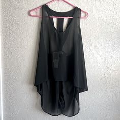 Black See Through Top, It’s Very Cute! The Back Has A Bow And Is Strapy At The Top, And Hangs Lower In The Back. Brand New Never Worn! Stretch Black Beach Blouse, Black Summer Blouse For Going Out, Black Stretch Beach Blouse, Beach Stretch Black Blouse, Black Summer Blouse For Layering, Chic Black Tank Top For Going Out, Black Sheer Tank Top For Evening, Casual Black Sheer Tank Top, Black Sheer Sleeveless Top