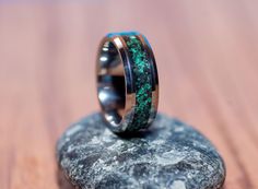 *This Ring* Material: Tungsten Carbide Inlay: Malachite, Obsidian and Pyrite Size: 8mm or 6mm Packaged in a modest black box. This ring is handmade where each stone is placed individually to insure the materials compliment each other. Every ring i make is slightly different than the one that came before it, so you know you're getting a unique piece. This ring dazzling as it catches light from multiple angles. The magnificent color of this ring will impress! *Return Policy* We do not accept retur Green Inlay Rings For Anniversary, Green Anniversary Rings With Inlay, Anniversary Green Inlay Rings, Mens Wedding Rings Tungsten, Mens Wedding Ring, Men's Wedding Ring, Engagement Band, Engagement Bands, Tungsten Carbide