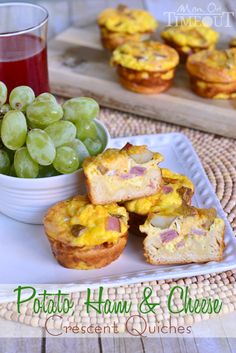 some muffins and grapes on a white plate