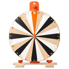 a close up of a dart board on a white background with orange and black stripes