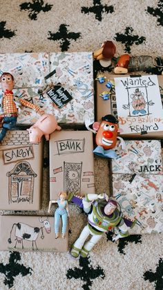 toys and books are laid out on the floor