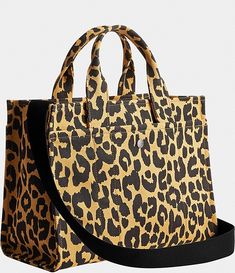 COACH Leopard Cargo Tote Bag | Dillard's Daily Use Coach Coated Canvas Satchel, Coach Travel Satchel In Coated Canvas, Trendy Coach Satchel For Travel, Coach Canvas Shoulder Bag For Everyday, Coach Canvas Shoulder Bag, Coach Canvas Bag With Removable Pouch, Coach Canvas Bag With Double Handles, Coach Canvas Bags With Double Handle, Coach Double Handle Canvas Bag