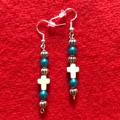 Beautiful, Silver Dangle Earrings With A Miniature White Cross, Simulated Blue Pearl Beads And Silver Spacer Beads. Cross Dangle Earrings, Unique Blue Earrings With Dangling Beads, Blue Star Charm Dangle Earrings, Blue Spiritual Dangle Earrings, Handmade Earings, Blue Cross-shaped Jewelry With 8mm Beads, Cherry Drop Earrings, Diy Earrings Easy, Vintage Stud Earrings