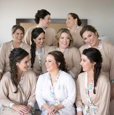 the bridesmaids are all wearing matching robes