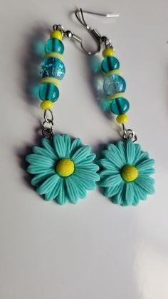 Teal sunflower handcrafted earrings Sunflower Design Dangle Earrings As Gift, Sunflower Design Dangle Earrings For Gift, Unique Handmade Blue Flower Earrings, Handmade Flower Jewelry For Crafting, Handmade Flower-shaped Whimsical Jewelry, Handmade Green Whimsical Earrings, Handmade Bohemian Flower Earrings Polymer Clay, Handmade Bohemian Polymer Clay Flower Earrings, Cute Handmade Green Jewelry