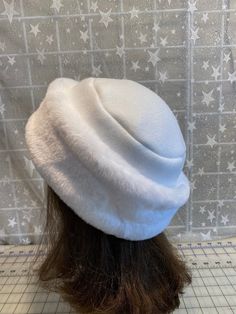 "I made this beautiful Snow White  hat out of soft white beaver faux fur and white fleece.  The brim is a 3 1/2 inch frame of white beaver faux fur and the hat is lined with a double layer of white fleece for warmth and comfort.  Sized to fit most adults 22\"-23\" around head. The hat is a comfortable fit on my 22 1/2\" head.  Spot clean or dry clean. Handmade in Albany, Oregon by me!" White Fur Felt Hat For Winter, White Fur Felt Winter Hat, White Felt Hat With Flat Brim For Winter, White Flat Brim Felt Hat For Winter, Classic White Cloche Hat With Short Brim, White Hat With Faux Fur Lining For Winter, White Short Brim Felt Hat For Winter, White Winter Hat With Faux Fur Lining, White Faux Fur Winter Hat