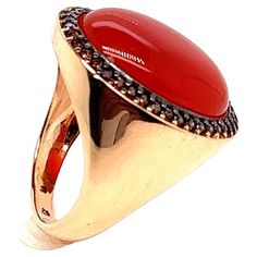 Discover this magnificent signet ring in 18-carat pink gold, featuring a superb cabochon of red onyx, topped with a dazzling brown zirconia. This French ring is a true masterpiece of craftsmanship, combining elegance and timeless style. The red onyx cabochon is the centerpiece of this ring, lending an aura of serenity and relaxation to the wearer. Its deep, haunting color adds a touch of mystery to your appearance, while soothing restless souls. Whether worn on the little finger, ring finger, mi Luxury Hallmarked Oval Cabochon Ruby Ring, Luxury Oval Cabochon Gemstone Signet Ring, Luxury Signet Ring With Oval Cabochon Gemstone, Red Domed Rings For Anniversary, Red Domed Anniversary Ring, Luxury Rose Gold Cabochon Rings, Luxury Red Cabochon Ruby Ring, Luxury Oval Cabochon Signet Ring For Anniversary, Red Domed Gemstone Rings