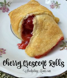 a cherry crescent roll on a plate with the word cherry crescent rolls written below it