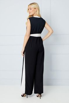 Sleeveless V-neck jumpsuit with a tailored fit
Wide leg silhouette for a flattering, elongated look
Contrast binding detail along the neckline and waist tie belt
woven fabric with a fluid drape
Ankle-grazing length for a sophisticated finish
Exuding effortless elegance, this tailored jumpsuit is a versatile choice for formal occasions. The wide leg silhouette creates a streamlined look, while the V-neckline and contrast binding add a touch of refinement. Pair it with heeled sandals and statement jewellery for a chic evening ensemble, or dress it down with trainers for a more casual daytime event. The woven fabric ensures a comfortable yet polished fit, making this jumpsuit a stylish investment piece. Tailored Jumpsuit, Petite Jumpsuit, Petite Coat, Lace Skater Dress, Statement Jewellery, Tall Clothing, Petite Tops, Tshirt Skirt, Effortless Elegance