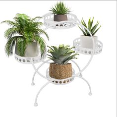 three potted plants sitting on top of each other in white planters with wicker baskets