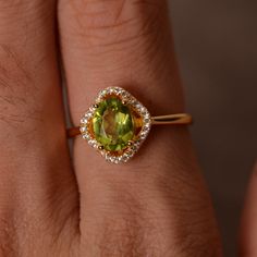 This is a gorgeous handmade creation. Its beauty is its simplicity & Elegance. The 6*8mm oval cut natural peridot is crafted in solid sterling silver and with yellow gold plated. All item is sent in a beautiful gift box You can realize more lovely stuff clicking the link https://www.etsy.com/shop/knightjewelry?refshopsection_shophome_leftnav Please leave the correct address and you phone number for delivering successfully. Luxury Oval Peridot Rings, Elegant Lime Green Oval Rings, Oval Green Citrine Rings, Elegant Lime Green Gemstone Rings, Classic Peridot Jewelry With Halo Setting, Yellow Gold Peridot Jewelry With Halo Setting, Elegant Peridot Birthstone Ring In Yellow Gold, Elegant Yellow Gold Peridot Birthstone Ring, Oval Peridot Birthstone Ring In Fine Jewelry