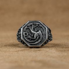 Daenerys Targaryen Dragon Silver Ring, Dragon Fashion Ring, Fantasy Jewelry For Boyfriend, Men Ring with Got Dragon, Anniversary Gift   Made of 925 silver and handcrafted by hand, this ring is not only an accessory piece that complements your daily elegance, but also has details that will reflect your character and style. It is also a great gift to give to your loved ones on their special days. At SavisSilver, we always give importance to the satisfaction of our customers, we recommend you to re Game Of Thrones Ring, Round Ring With Steel Shank For Gift, Round Steel Shank Rings As Gifts, Targaryen Ring, Jewelry For Boyfriend, Daenerys Targaryen Dragons, Got Dragon, Dragon Fashion, Got Dragons