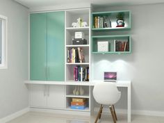 a white desk sitting under a window next to a green book shelf filled with books