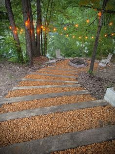 there are many chairs and lights in the woods