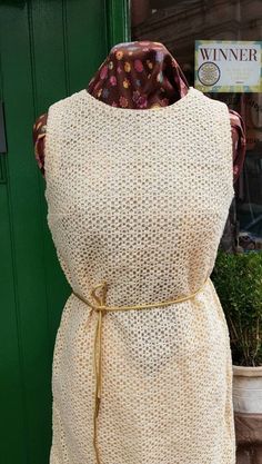 "Beautiful Vintage early 1960s crocheted dress with gold belt. Stunning piece that fits the size 8 mannequin really well,seems pretty straight from pit right down to hem. In an unworn condition with no marks or pills,fully lined with what feels like silk. Can be worn with or without the belt. Marked  as a size 36 which is about a uk 10. Perfect would be size 8 to 10 max. Measurements as follows are.  Shoulder-shoulder  Pit-pit (bust) 17&1/4\" Waist 16 &3/4\" Hips 18\" Pit-hem 30&1/2\" Nape-hem 37\" Width at hem 19&1/2\" inches  In as new condition  My Generation Vintage on FB and Instagram" Vintage Sleeveless Crochet Dress, Retro Fitted Sleeveless Crochet Dress, Retro Sleeveless Crochet Dress For Spring, Fitted Sleeveless Retro Crochet Dress, Vintage Sleeveless Crochet Dress For Spring, Mod Scooter, Crocheted Dress, Leather Waistcoat, Mary Quant