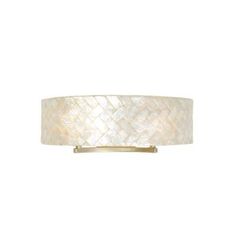 a light fixture with a white drum shade on the bottom and gold trimmings