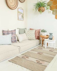 a living room filled with lots of pillows