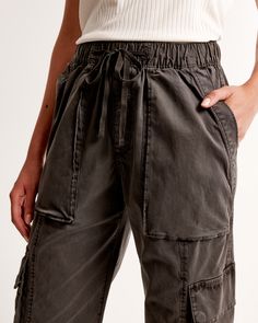 Elevate your casual wardrobe with the Abercrombie & Fitch Women's Pull-On Wide Leg Cargo Pant in a sophisticated dark grey. These pants blend functionality with style, perfect for the modern woman on the go.

- Size: M SHORT
- Color: Dark Grey
- Material: Body and pocket bag made from cotton
- Gender: Female
- Age Group: Adult
- Features: High-rise, wide-leg silhouette, elasticated waistband with functional drawcords, cargo-inspired details, zipper detail at cuffs, multiple pockets

Crafted from Relaxed Fit Wide Leg Bottoms With Drawstring, Spring Utility Bottoms For Elevated Casual, Straight Leg Cotton Bottoms With Drawstring, Relaxed Fit Wide Leg Cargo Pants With Elastic Waistband, Relaxed Fit Cotton Bottoms With Drawstring, Relaxed Fit Wide-leg Cargo Bottoms, Relaxed Fit Wide Leg Cargo Pants With Drawstring, Relaxed Fit Wide-leg Cargo Pants With Elastic Waistband, Utility Pants With Elastic Waistband And Relaxed Fit