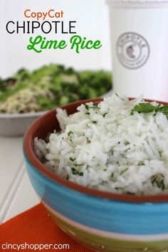 a bowl filled with white rice next to a cup of coffee