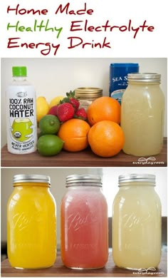 three jars filled with different types of fruit and drinks on top of a wooden table