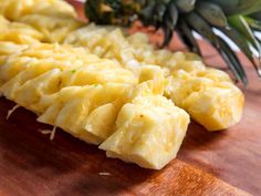 pineapple chunks are arranged on a cutting board