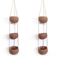 two hanging planters made out of wood and rope