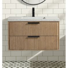 a bathroom vanity with a round mirror above it and tiled flooring in the background