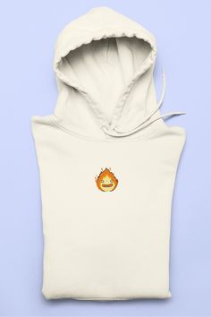 Calcifer hoodie from Howl's Moving Castle! This hoodie is made with recycled materials so you can be cute and save the planet :) The women's eco fitted hoodie offers a feminine, slim cut and will feel extra soft on your skin. Pair it with sweats, jeans, or a dress, and add it to your wardrobe today. * 80% ring-spun organic cotton, 20% recycled polyester * Heather Grey is 71% ring-spun organic cotton, 25% recycled polyester, 4% viscose * Fabric weight: 8.3 oz/yd² (280 g/m²) * Feminine cut * Side-seamed pockets * Single jersey lined hood * Herringbone neck tape (inside, back of the neck) ► SIZE: 👉 MAKE SURE you get the RIGHT SIZE before you place your order! 👈 All sweatshirts are unisex heavy blend crewnecks. Please refer to size chart in the photos. RETURN POLICY I do not accept returns o Cotton Hooded Hoodie For Gift, Cotton Hooded Hoodie As Gift, Anime Sweater, Ghibli Anime, Fitted Hoodie, Anime Clothing, Howl's Moving Castle, Clothing Streetwear, Anime Gifts