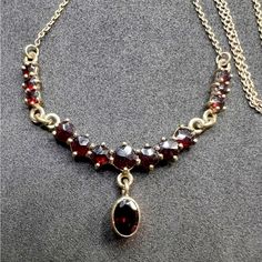 Stunning Vintage Garnet 8k Gold 18” Necklace Marking “333” 8 Karat Gold “299” “Kr T” Hallmark As Yet Is Still Unidentified, But Favors The Look Of Austrian Jewelers Of The Time Period Total Weight ~ 5.1 Grams Circa 1940s Size: 18” (6) Garnet ~ 3mm Diameter X 1.5mm Depth (1) Garnet ~ 5mm Diameter X 2mm Depth (1) Garnet ~ 7 X 4mm X 2.5mm Depth #17177chkes Time Period, Red Gold, Womens Jewelry Necklace, Hallmark, Garnet, Vintage Jewelry, Period, Jewelry Necklaces, Women Jewelry