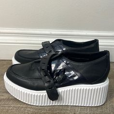 Please See There Is Wear On Shoes . Never Worn . Kept In Storage . Black Synthetic Platform Sneakers With Lug Sole, Black Platform Sneakers With Round Toe, Edgy Black Platform Sneakers With Lug Sole, Edgy Platform Sneakers With Rubber Sole, Black Patent Leather Sneakers With Round Toe, Edgy Black Platform Sneakers With Round Toe, Black Pointed Toe Synthetic Sneakers, Black Sneakers With Lug Sole And Flat Heel, Slip-on Platform Sneakers With Round Toe