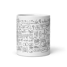 a white coffee mug filled with lots of doodles