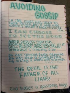 an open notebook with writing on it in green and blue ink, which reads avoiding gossip