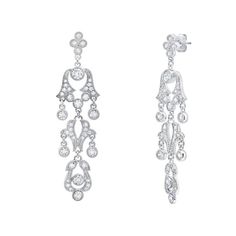 not specified Elegant White Gold Chandelier Earrings With Crystals, Elegant White Gold Crystal Chandelier Earrings, Glamorous Silver Diamond Chandelier Earrings, Glamorous Crystal Chandelier Earrings With Elegant Design, Elegant Crystal Chandelier Earrings For Evening, Elegant Diamond Chandelier Earrings With Rhinestones, Dazzling Silver Chandelier Drop Earrings, White Gold Crystal Chandelier Earrings, White Gold Crystal Dangle Chandelier Earrings