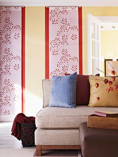 a living room filled with furniture and pillows