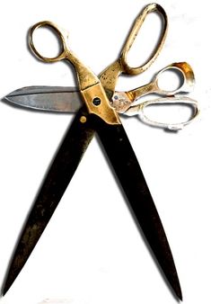 a pair of gold scissors with black handles