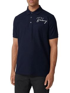 Experience luxury and style with the Burberry Signature Pique Cotton Polo Shirt. Made from midnight blue or black cotton and in a piqué weave, this oversized polo shirt features an embroidered logo on the chest and a classic polo collar. The front button placket, short sleeves, chest patch pocket, and side slits add practicality, while the high-low hem adds a touch of elegance. Elevate your wardrobe with this iconic piece. Burberry Script Signature Embroidery in Contrasting White 100% Pique Cott Oversized Polo Shirt, Oversized Polo, Cotton Polo Shirt, Cotton Polo, Polo Collar, Mens Shirt Dress, High Low Hem, Button Placket, Midnight Blue