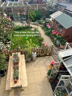 an aerial view of a garden with lots of flowers and plants in the middle of it