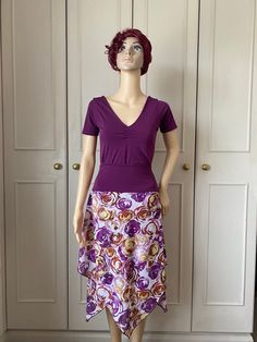 This skirt has a wide waistband in purple jersey. The skirt is non stretch and is made in an almost sheer light chiffon in abstract design in shades of purple, yellow and white. The skirt has two layers and is designed to vary in length. This falls loosely from the waistband and is free flowing. Great for dancewear. Matching top available Measurements  One available in small size only SOLD OUT Waist 58-78cm  Hips up to 100cm Length at longest point 77cm One available in medium size only  Waist 6 Stretch Skirted Dress With Elastic Waistband, Stretch Dresses With Elastic Waistband And Skirted Shape, Stretch Dresses With Elastic Waistband, Fitted Purple Dress With Lined Skirt, Purple Spring Dress With Lined Skirt, Fitted Purple Maxi Skirt For Summer, Purple Flowy Long Dress, Fitted Flared Skirt Dress With Elastic Waistband, Purple Long Flowy Dress