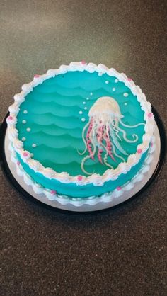 a cake decorated with an image of a jellyfish