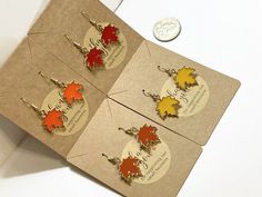 Fall Leaf Earrings, Autumn Earrings, Fall Fashion, Fall Accessories, Thanksgiving jewelry, Nature, Leaf charms, Maple leaf, Leaves, Gift idea Show your love for Autumn with these lovely Fall Maple Leaf Earrings. Each pair of earrings are about 3/4 of an inch long and are attached to metal fish hook style backings with a rubber stopper. We offer the option to purchase one pair in the color of your choice or the option for all 4 pairs as one set so please be sure to double check your options :) As Fall Wedding Bridesmaids, Thanksgiving Jewelry, Autumn Earrings, Jewelry Nature, Metal Fish, Fall Leaf, Fall Earrings, Fall Accessories, Leaf Charms