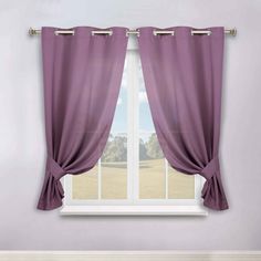 a window with purple curtains in front of it