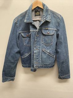 Add a dose of vintage-inspired style to your wardrobe with this Maverick Women's Blue Denim Motorcycle Jacket. Crafted from premium-quality cotton denim, this jacket is perfect for pairing with your favorite jeans or skirts. It features flap pockets, providing ample storage space for all your small essentials. This jacket is designed for regular fit and comes in size S. The blue color adds a touch of sophistication to your outfit, while the denim fabric type ensures durability and comfort. Ideal for women who love to ride motorcycles or for those who simply want to add a trendy piece to their wardrobe. Vintage Blue Denim Vest For Fall, Vintage Jeans With Patch Pockets For Fall, Fitted Denim Jacket With Flap Pockets, Retro Spring Denim Jacket With Patch Pockets, Vintage Fall Jeans With Patch Pockets, Retro Denim Vest With Pockets For Fall, Vintage Jeans With Pockets For Fall, Fitted Vintage Denim Vest For Winter, Vintage Denim Jacket With Button Closure For Streetwear