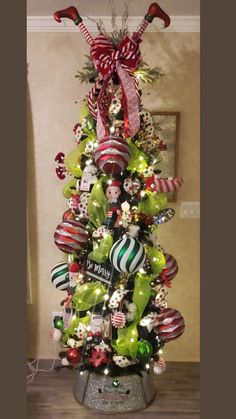 a christmas tree decorated with green and red ornaments