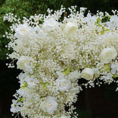 a bunch of white flowers in a vase