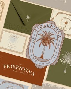 several different types of business cards with palm trees in the middle and below them, all on top of each other