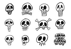 a bunch of skulls that are drawn in black and white