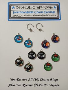 six charms with different designs on them are displayed in front of a sign that reads, you receive all 10 charm rings also